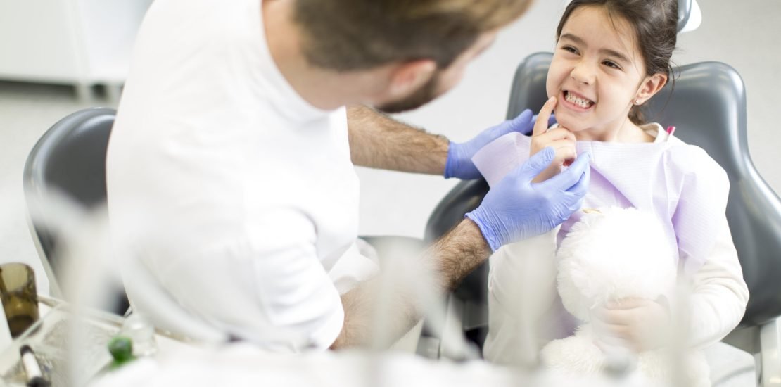 Little girl having dental control